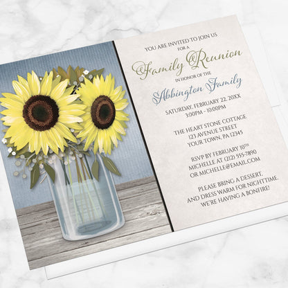 Sunflower Blue Mason Jar Rustic Family Reunion Invitation shown at an angle on a marble surface with a white envelope.