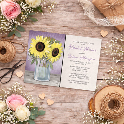 Sunflower Purple Mason Jar Rustic Bridal Shower Invitation on a wooden surface with flowers and twine.