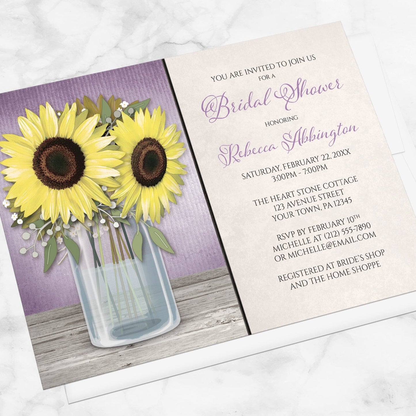 Bridal shower invitation with sunflowers and purple design displayed at an angle with a white envelope on a marble surface