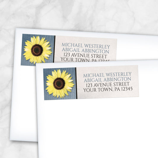 2 Sunflower and Blue Rustic Address Labels shown on white envelopes on a marble surface