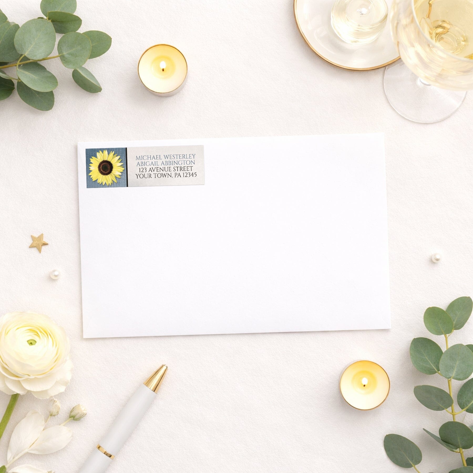 Sunflower and Blue Rustic Address Label shown on a white envelope with wedding and bridal shower supplies