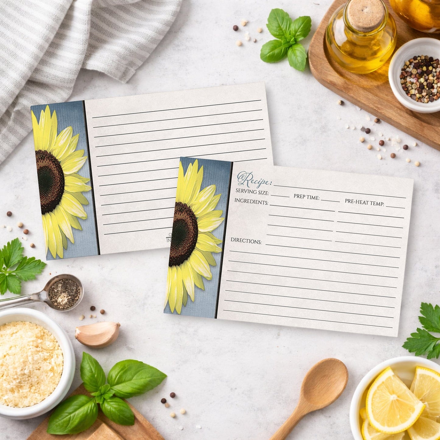 Set of Sunflower and Blue Rustic Recipe Cards on a kitchen counter with ingredients.