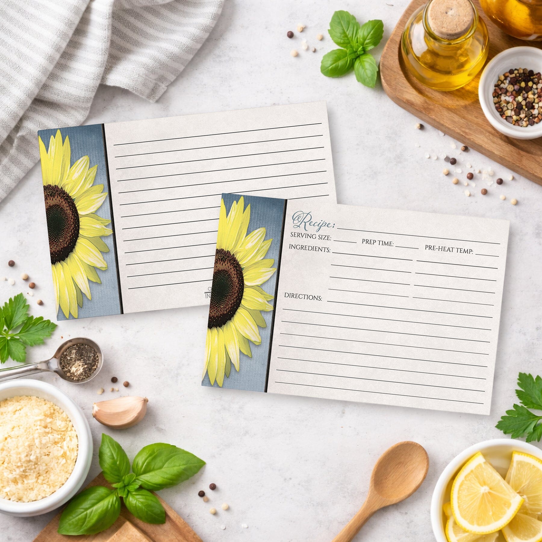 Set of Sunflower and Blue Rustic Recipe Cards on a kitchen counter with ingredients.