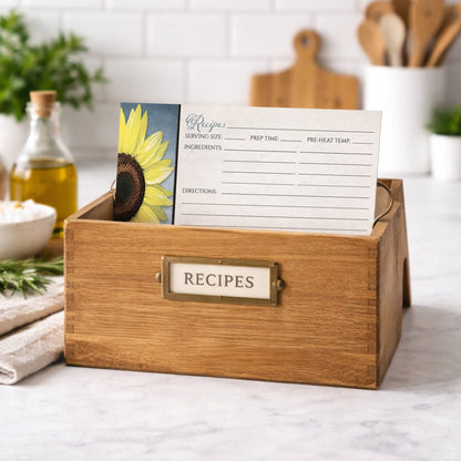 Wooden recipe box with a Sunflower and Blue Rustic Recipe Card on a kitchen counter.