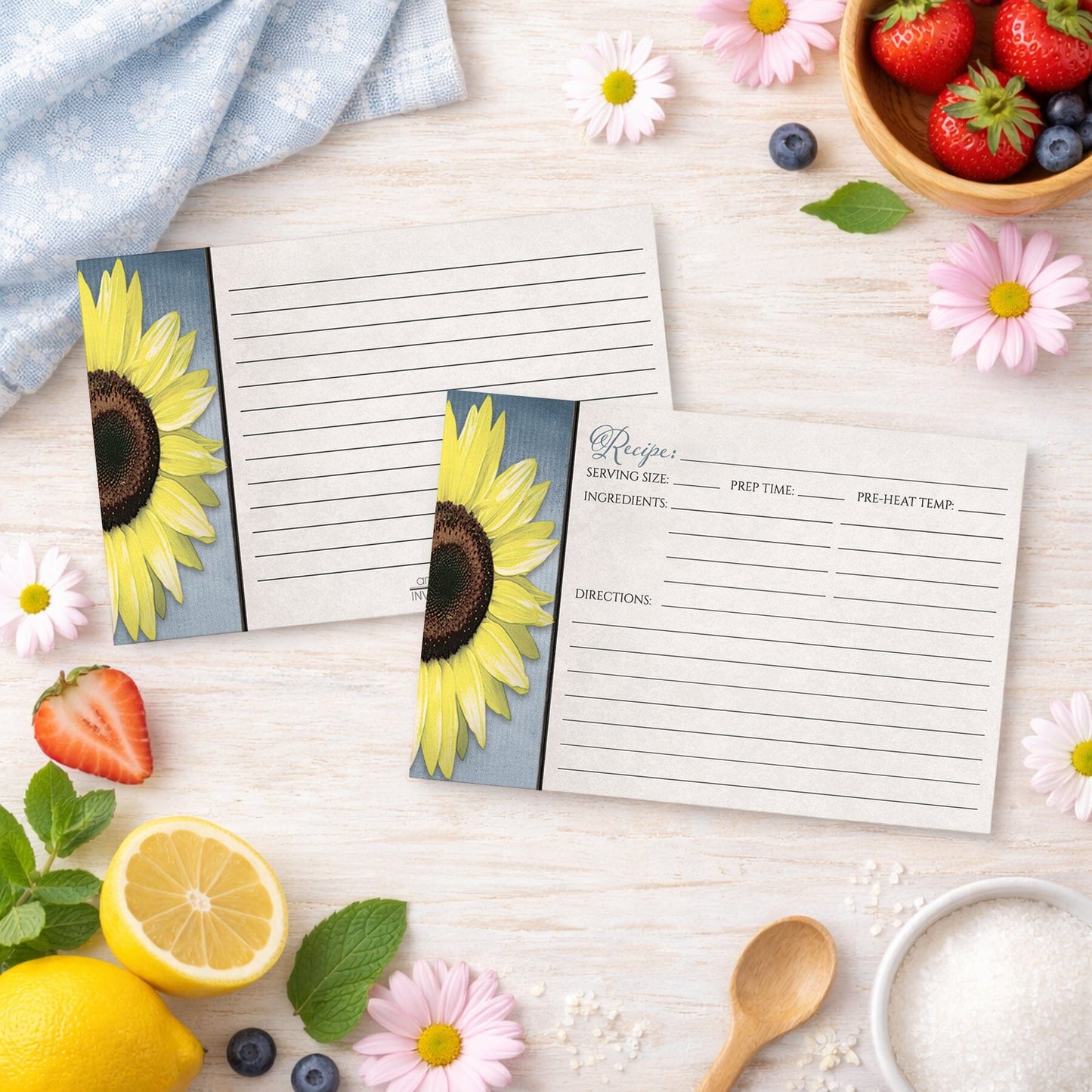 Set of Sunflower and Blue Rustic Recipe Cards on a wooden surface with summer fruits and flowers.