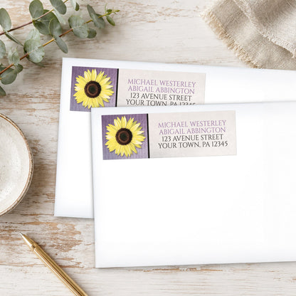 Sunflower and Purple Rustic Address Labels, on white envelopes, with eucalyptus leaves and a pen on a wooden surface.