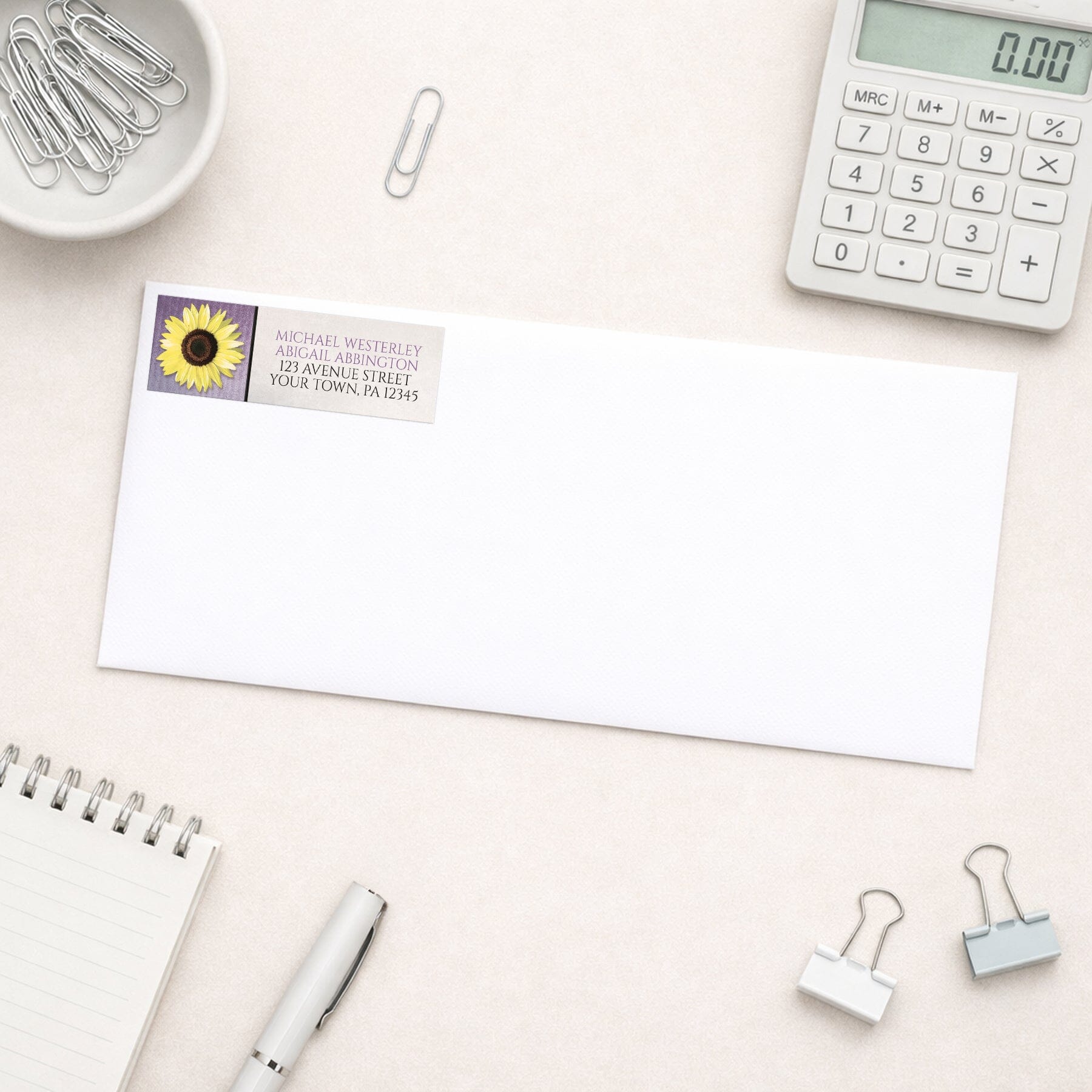 Sunflower and Purple Rustic Address Label shown on a white envelope with office supplies