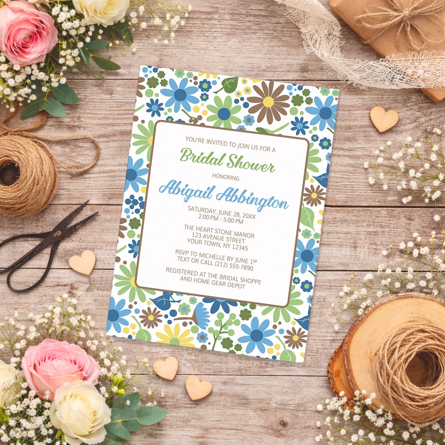 Sunny Summer Flowers Bridal Shower Invitation on a wooden surface with flowers and twine.