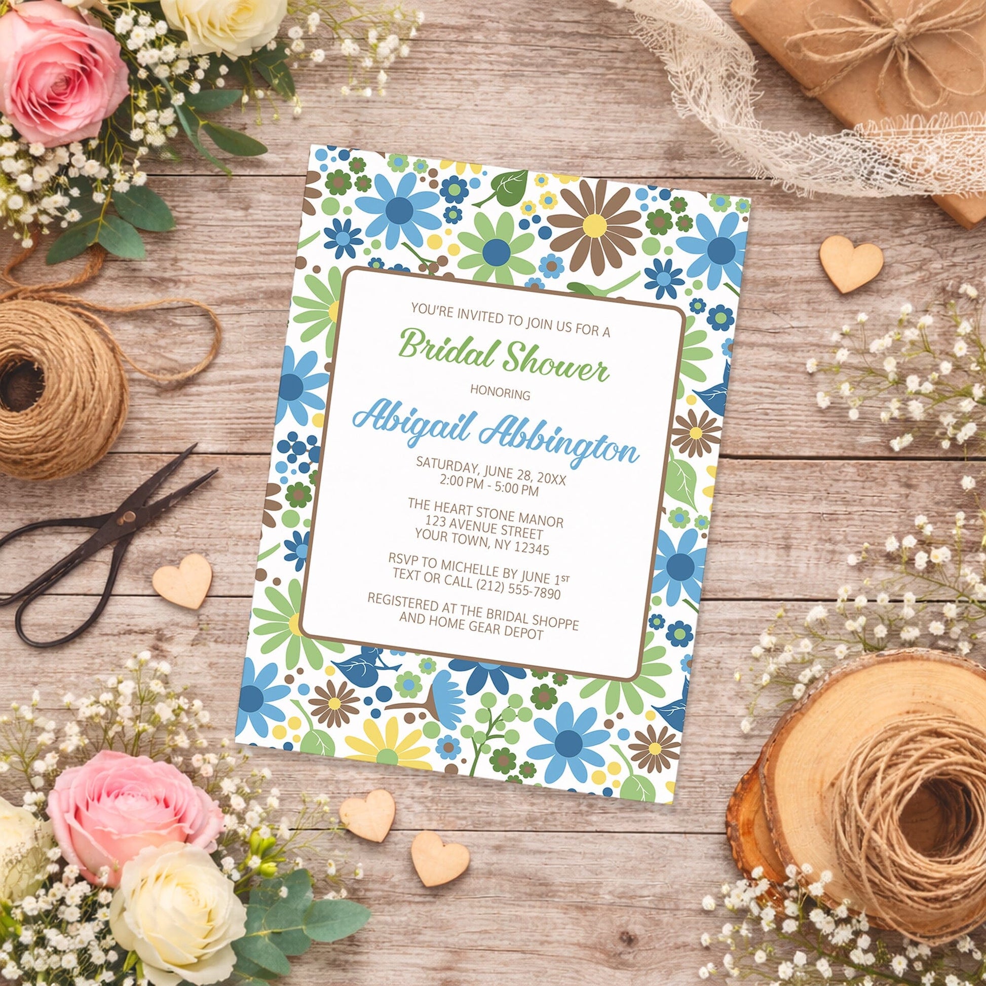 Sunny Summer Flowers Bridal Shower Invitation on a wooden surface with flowers and twine.