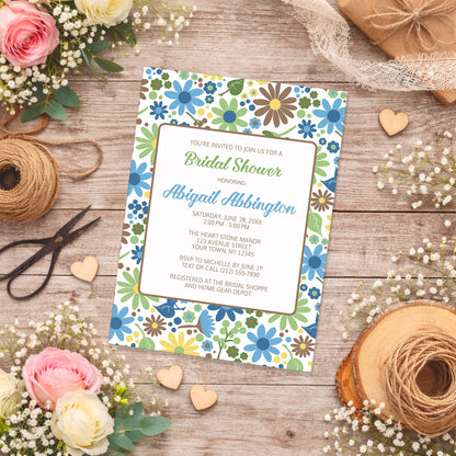 Sunny Summer Flowers Bridal Shower Invitation on a wooden surface with flowers and twine.