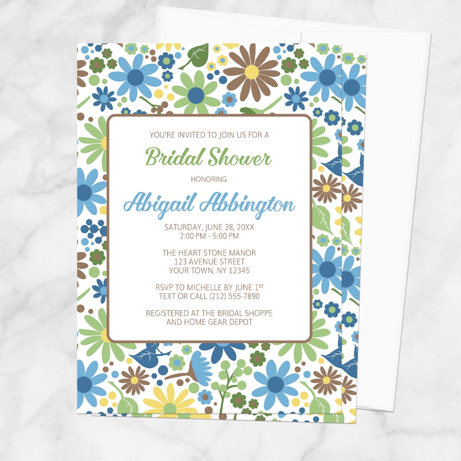 Bridal Shower invitation with flowers in blue, green, yellow, and brown, shown with a white envelope, on a marble surface
