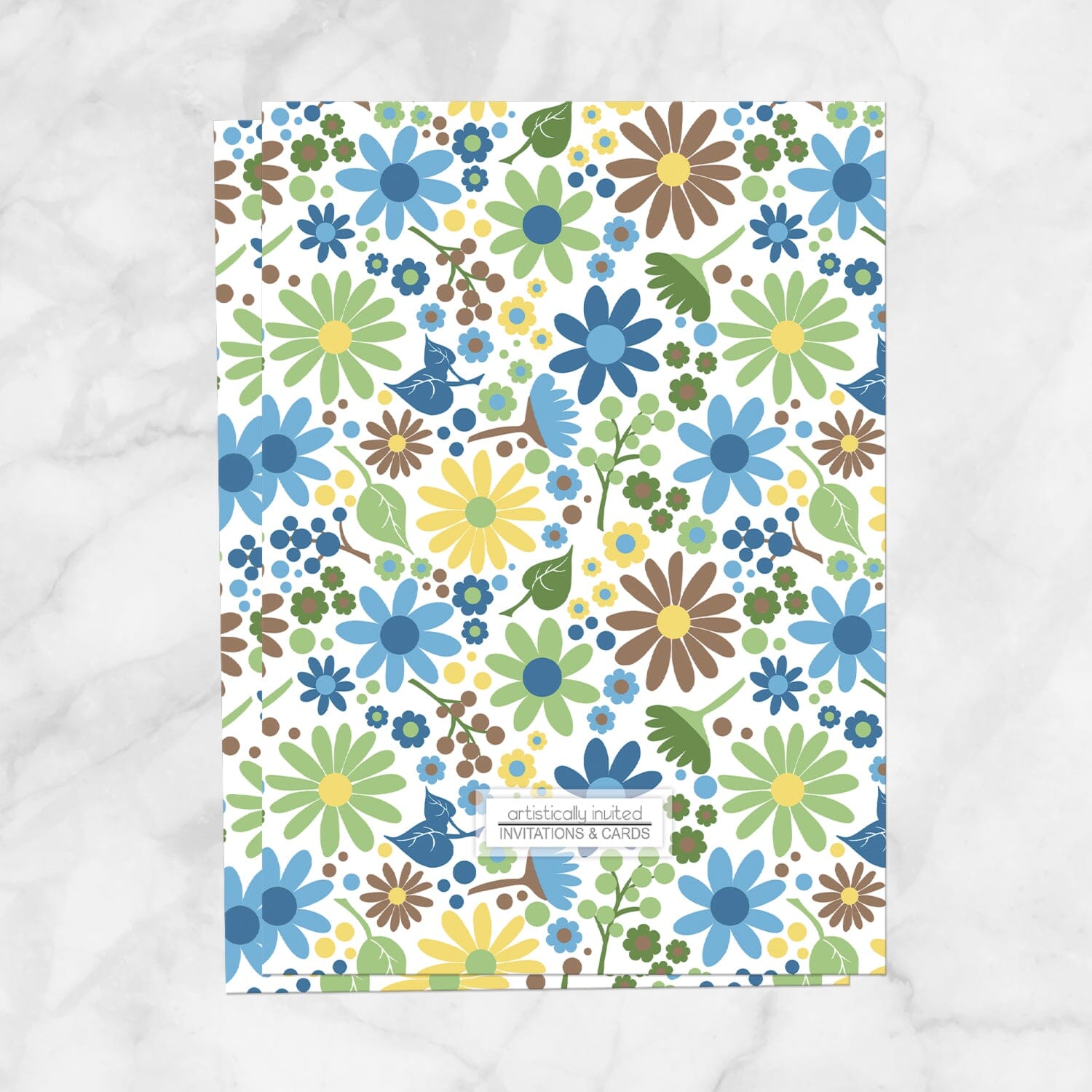 The backside of the bridal Shower invitation (designed flowers in blue, green, yellow, and brown) is printed when the printed invitations upgrade is selected. Invitation is shown on a marble surface.