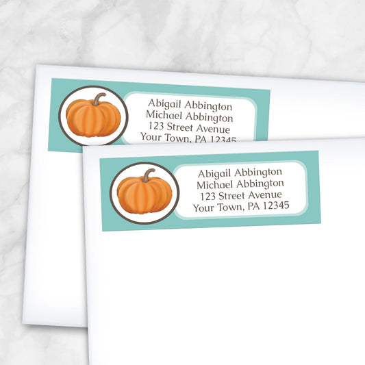 2 Teal Pumpkin Address Labels shown on white envelopes on a marble surface