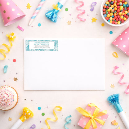 Teal Snowflake Winter Return Address Label shown on a white envelope with party supplies