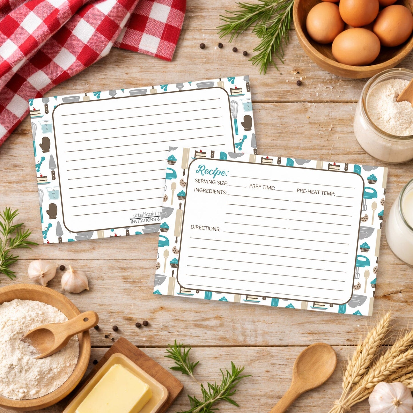 Two Turquoise Baking Pattern Recipe Cards on a wooden surface with country kitchen items around
