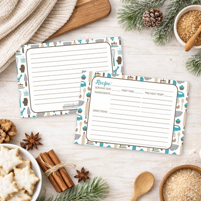 Two Turquoise Baking Pattern Recipe Cards on a wooden surface with holiday decorations and cookies.