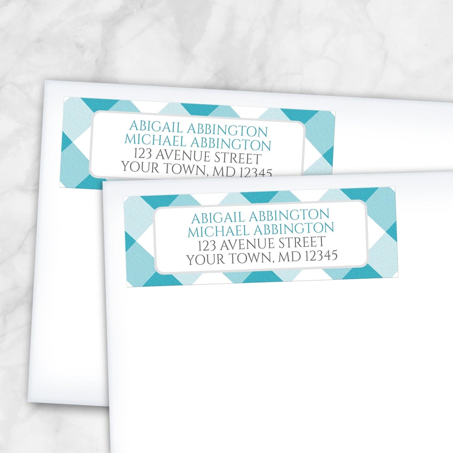 2 Turquoise Gingham Address Labels shown on white envelopes on a marble surface