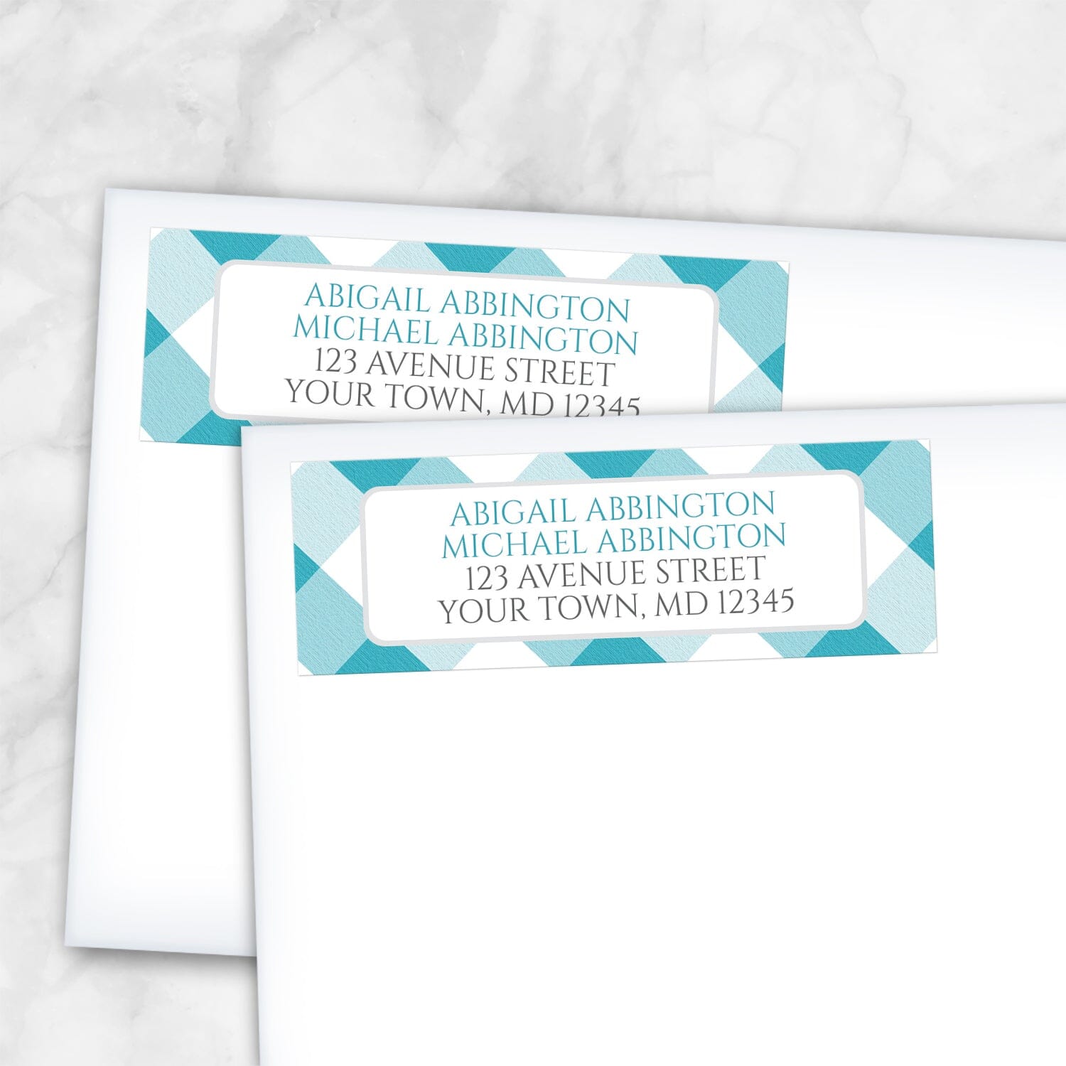 2 Turquoise Gingham Address Labels shown on white envelopes on a marble surface