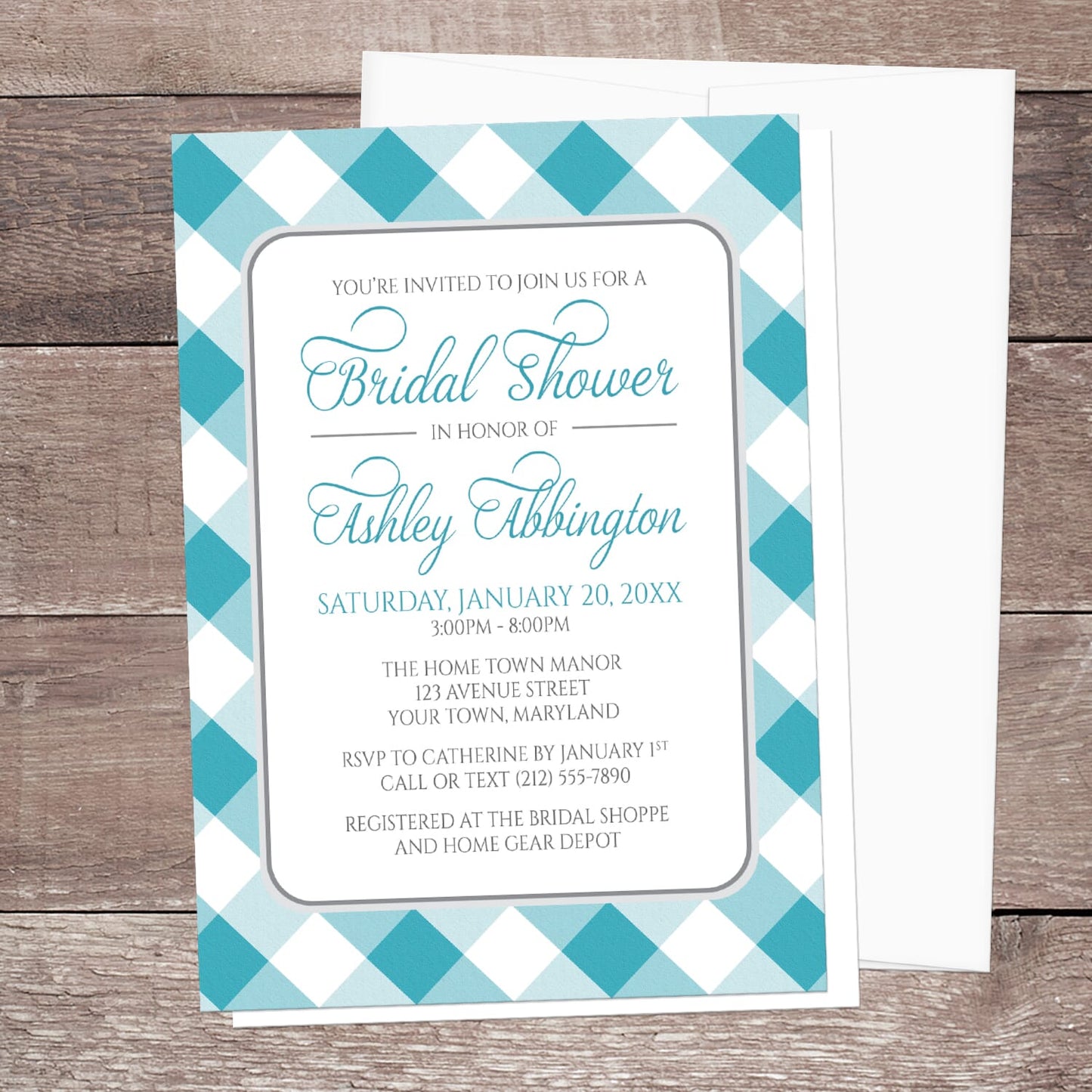 Bridal shower invitation with turquoise and white check border, displayed with a white envelope on a wooden surface