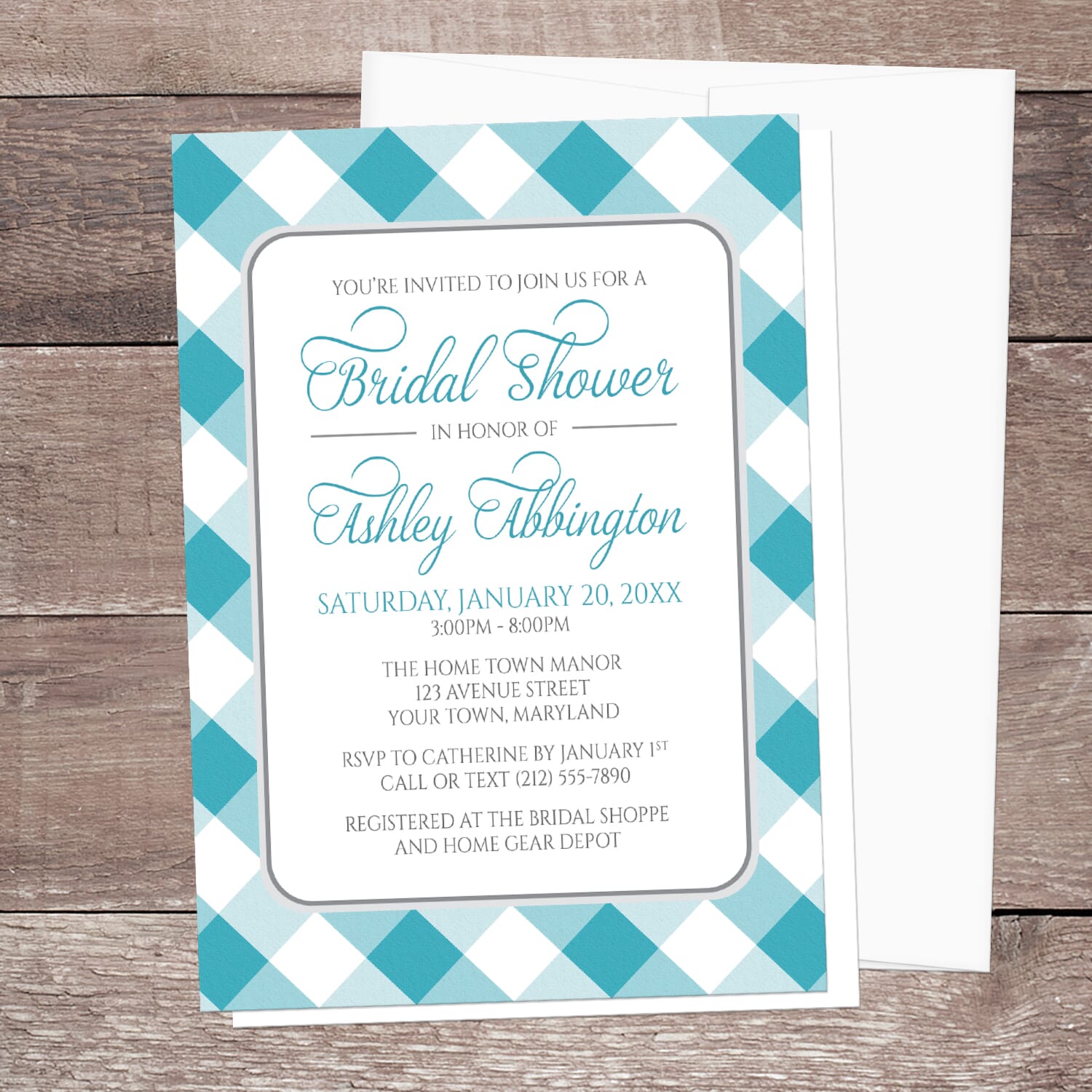 Bridal shower invitation with turquoise and white check border, displayed with a white envelope on a wooden surface