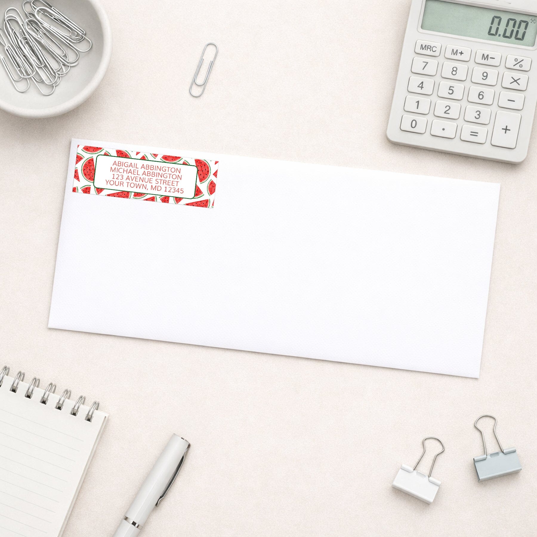 Watermelon Slices Address Label shown on a white envelope with office supplies