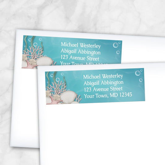 2 Whimsical Under the Sea Address Labels shown on white envelopes on a marble surface