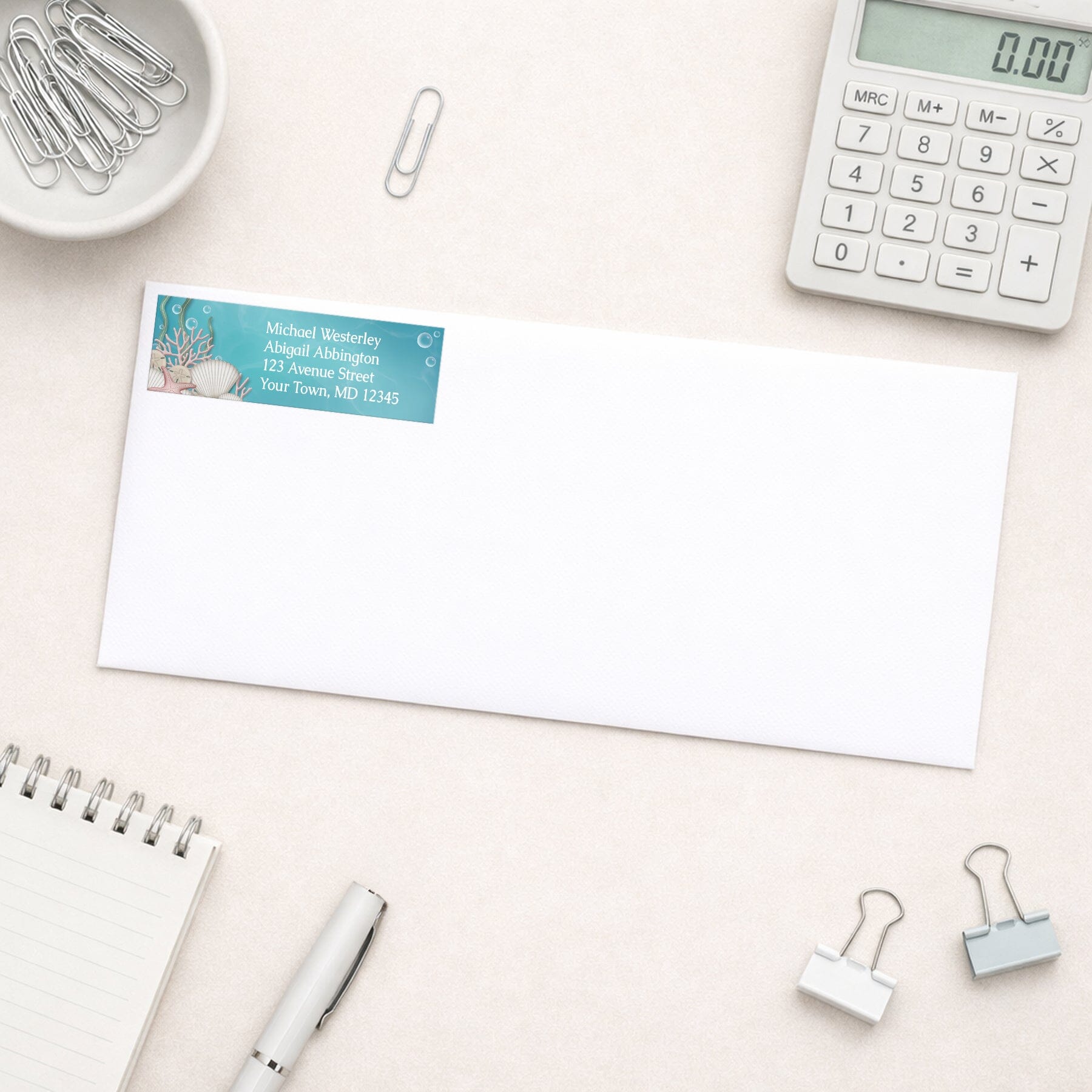 Whimsical Under the Sea Address Label shown on a white envelope with office supplies