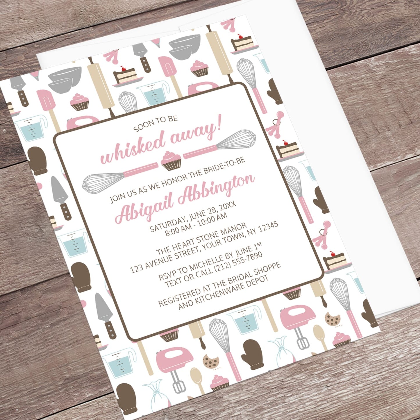 Baking-themed invitation laid on a wooden surface