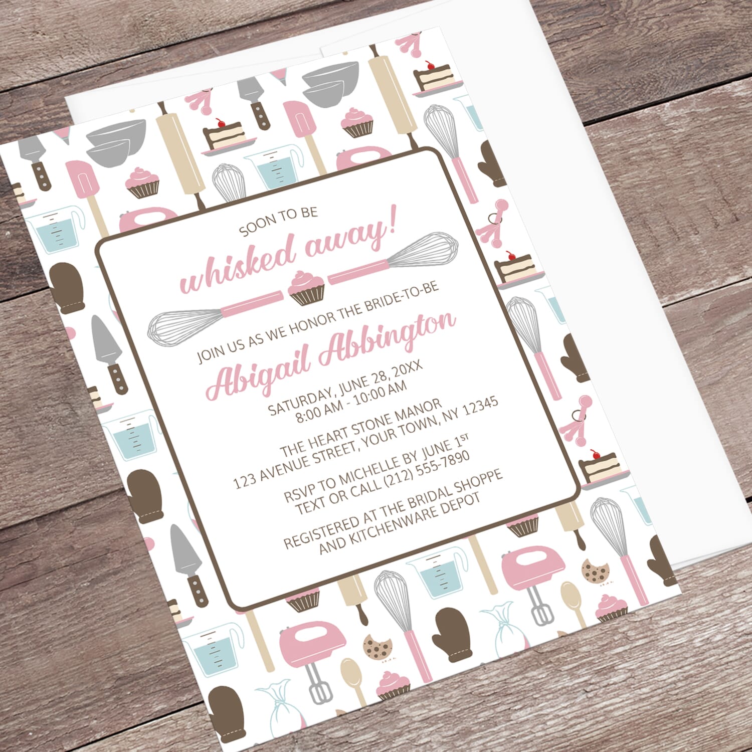 Baking-themed invitation laid on a wooden surface