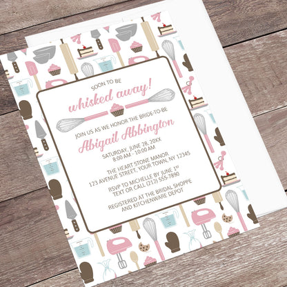 Baking-themed invitation laid on a wooden surface