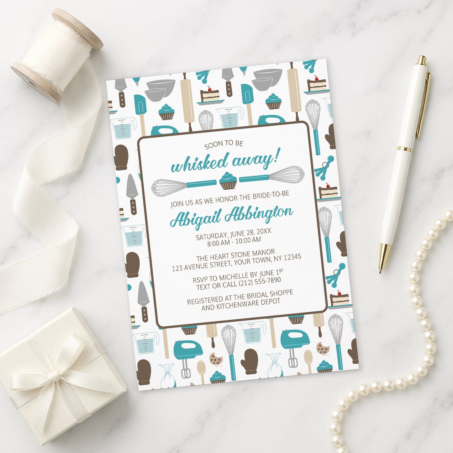 Whisked Away Turquoise Baking Bridal Shower Invitation with a kitchen tools and sweets theme, shown on a marble surface with a white gift box, pen, ribbon, and pearls.