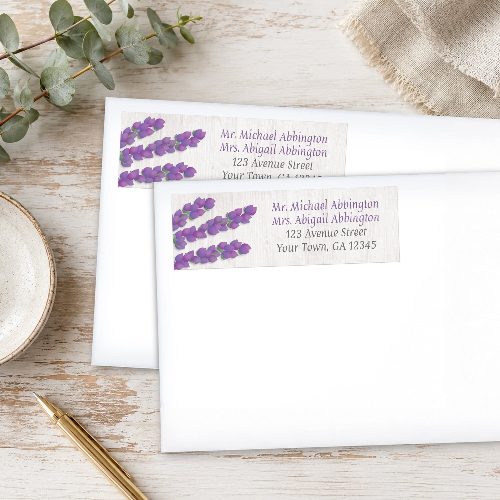 Whitewashed Wood Lavender Address Labels shown on white envelopes, on a wooden surface with a plant and a pen.