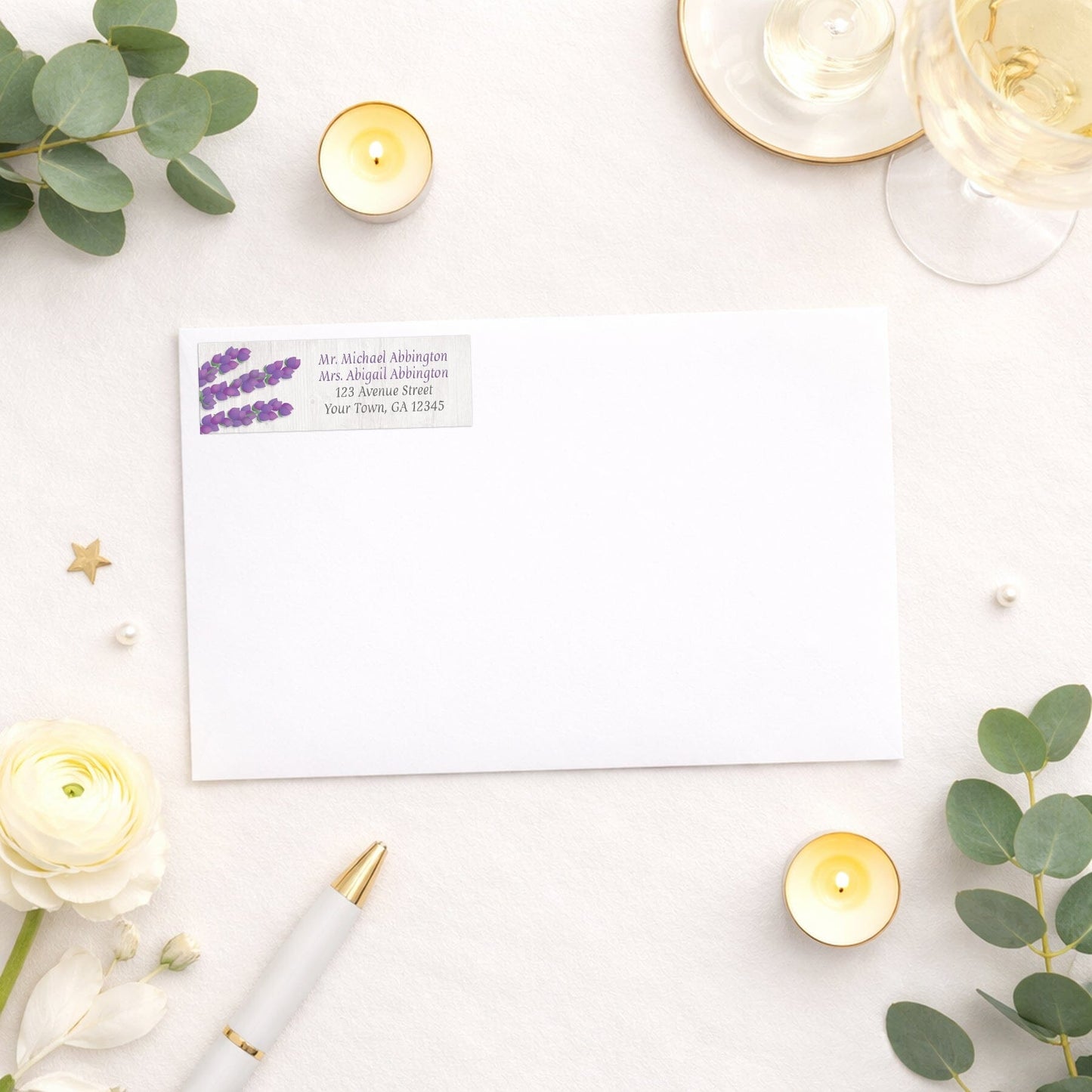Whitewashed Wood Lavender Address Label shown on a white envelope with wedding and shower supplies