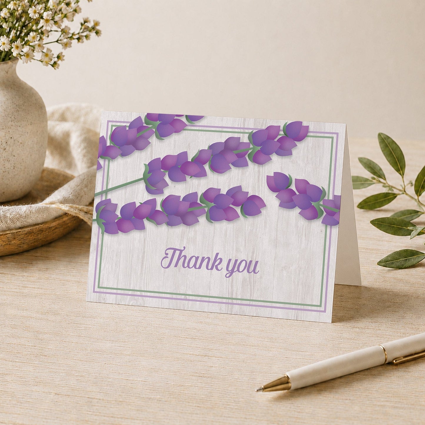 Whitewashed Wood Lavender Thank You Card shown on a desk with a vase and pen.