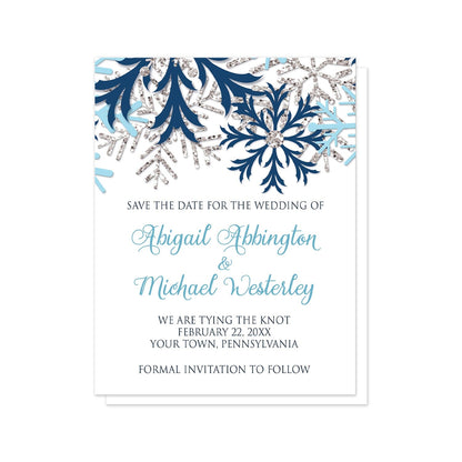 Winter Blue Silver Snowflake Save the Date Cards at Artistically Invited. Beautiful winter blue silver snowflake save the date cards designed with navy blue, aqua blue, and silver-colored glitter-illustrated snowflakes along the top over a white background. Your personalized wedding date details are custom printed in blue and navy blue below the pretty snowflakes.