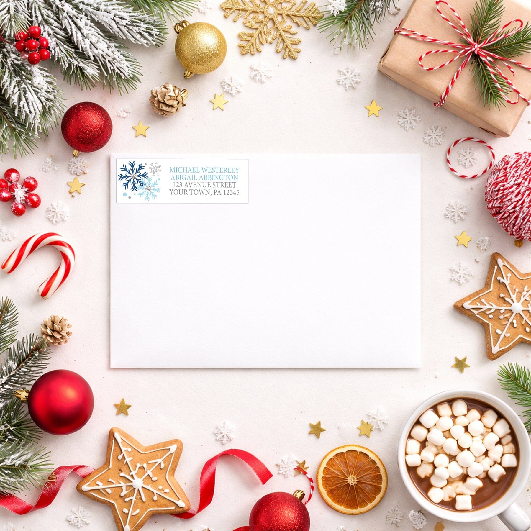 Winter Blue Silver Snowflake Address Label shown on a white envelope with winter Christmas holiday supplies