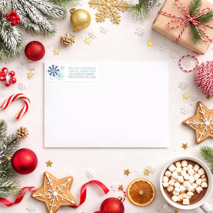 Winter Blue Silver Snowflake Address Label shown on a white envelope with winter Christmas holiday supplies