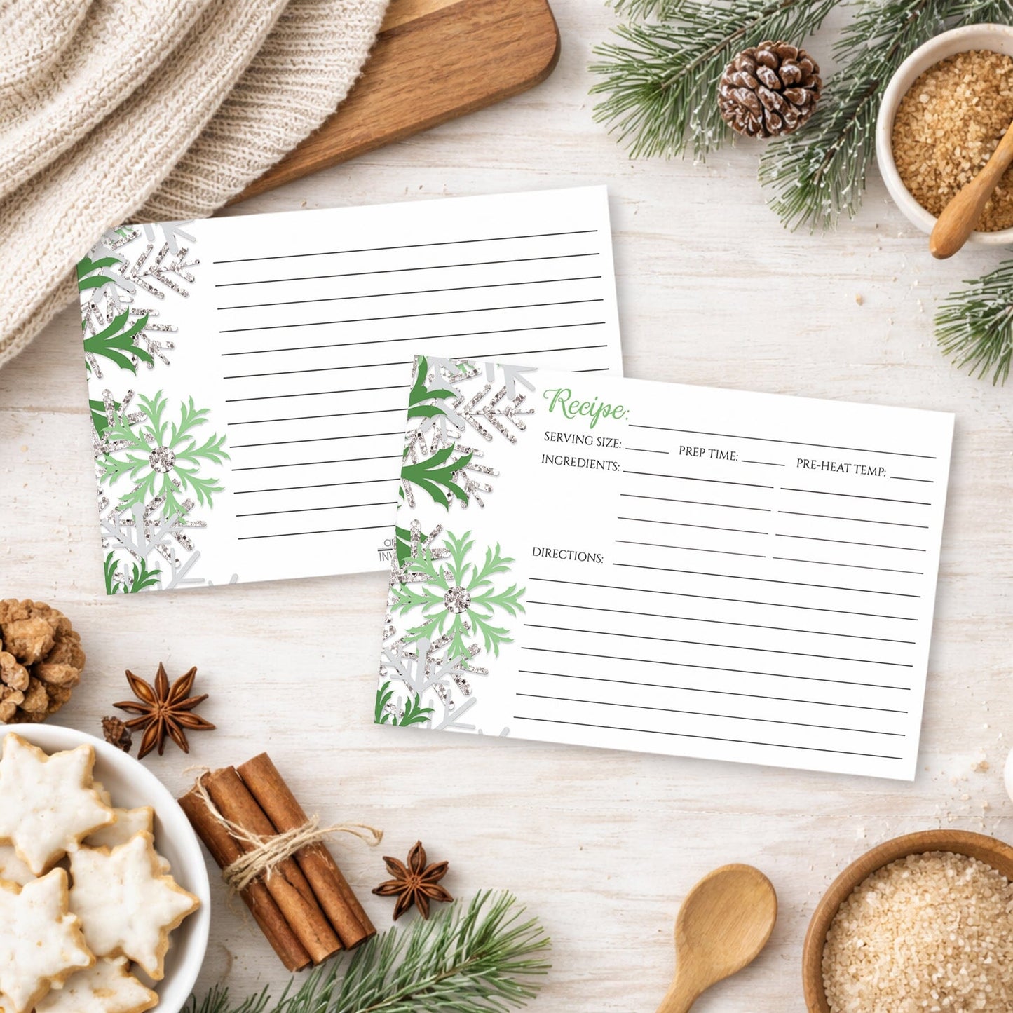 Set of Winter Green Silver Snowflake Recipe Cards on a festive table with holiday cookies and spices.