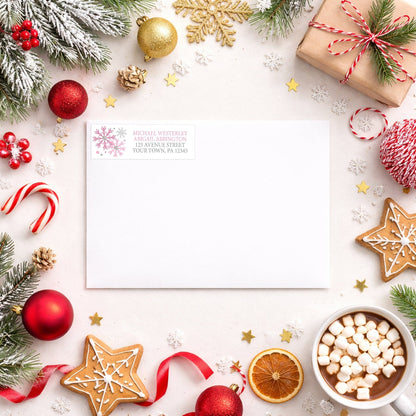 Winter Pink Silver Snowflake Address Label shown on a white envelope with winter Christmas holiday supplies
