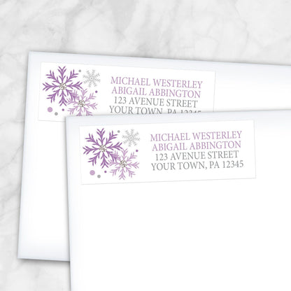 2 Winter Purple Silver Snowflake Address Labels shown on white envelopes on a marble surface
