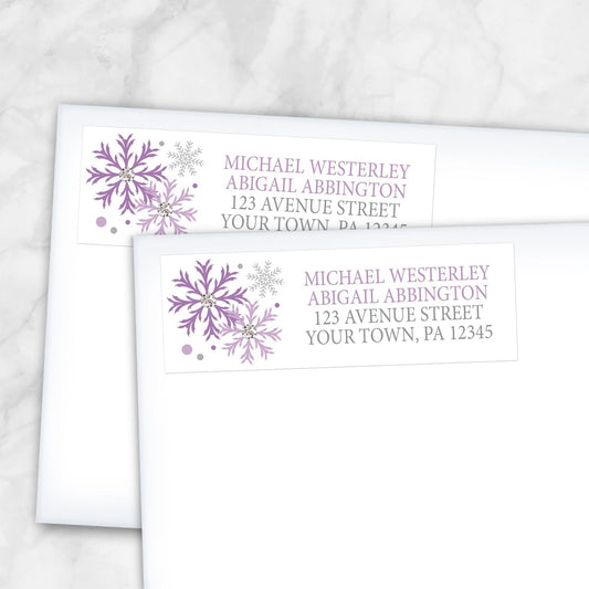 2 Winter Purple Silver Snowflake Address Labels shown on white envelopes on a marble surface