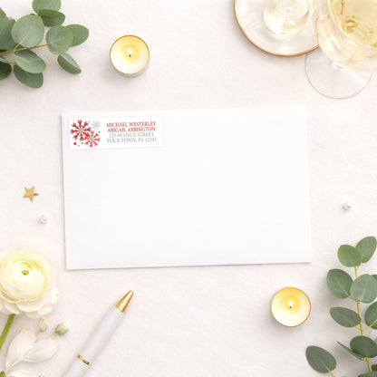 Winter Red Silver Snowflake Address Label shown on a white envelope with wedding and shower supplies