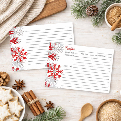 Two Winter Red Silver Snowflake Recipe Cards on a festive table with holiday cookies and spices.