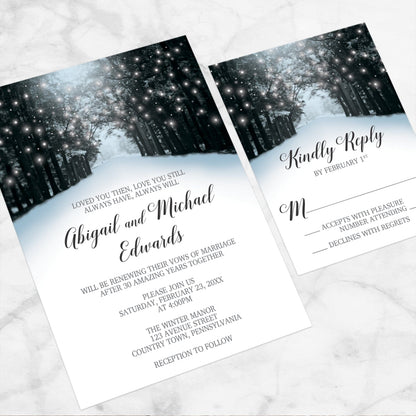 Snowy Winter Road Tree Lights Vow Renewal Invitation shown at an angle on a marble surface with the matching RSVP card.