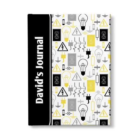 Personalized Yellow Electrical Pattern Journal at Artistically Invited. A custom book designed with a black color black wrapping over the spine area, over a yellow electrical pattern over the rest of the cover. This pattern has different electrical symbols and other images related to electricity in yellow, black, and gray. Your name is printed sideways in white over the black color block area on the front of the cover near the spine.