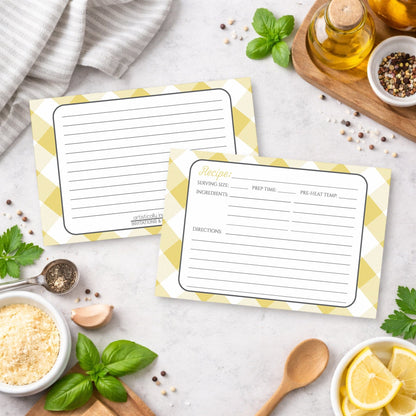Two Yellow Gingham Recipe Cards on a kitchen counter with ingredients.