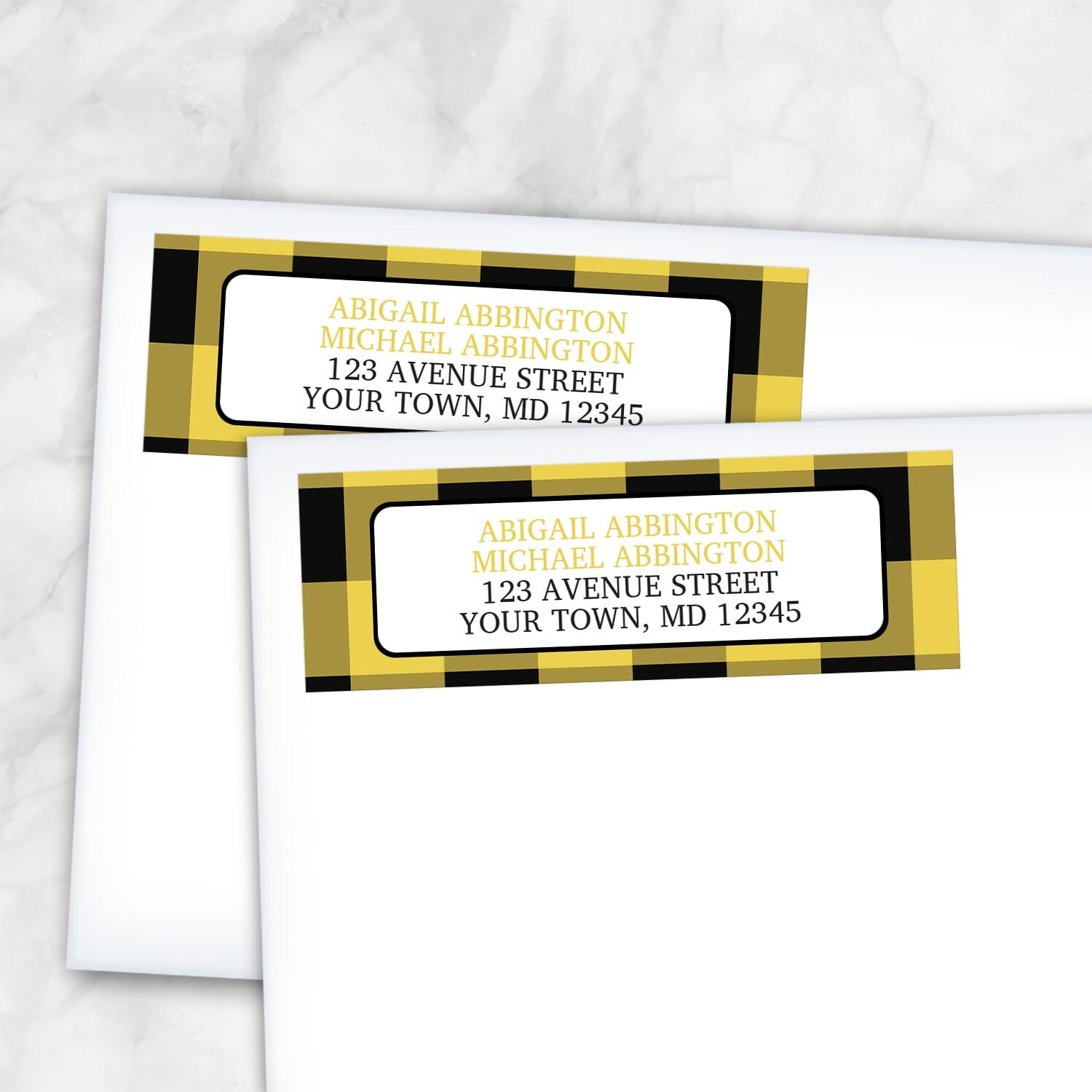 2 Yellow and Black Buffalo Plaid Address Labels shown on white envelopes on a marble surface