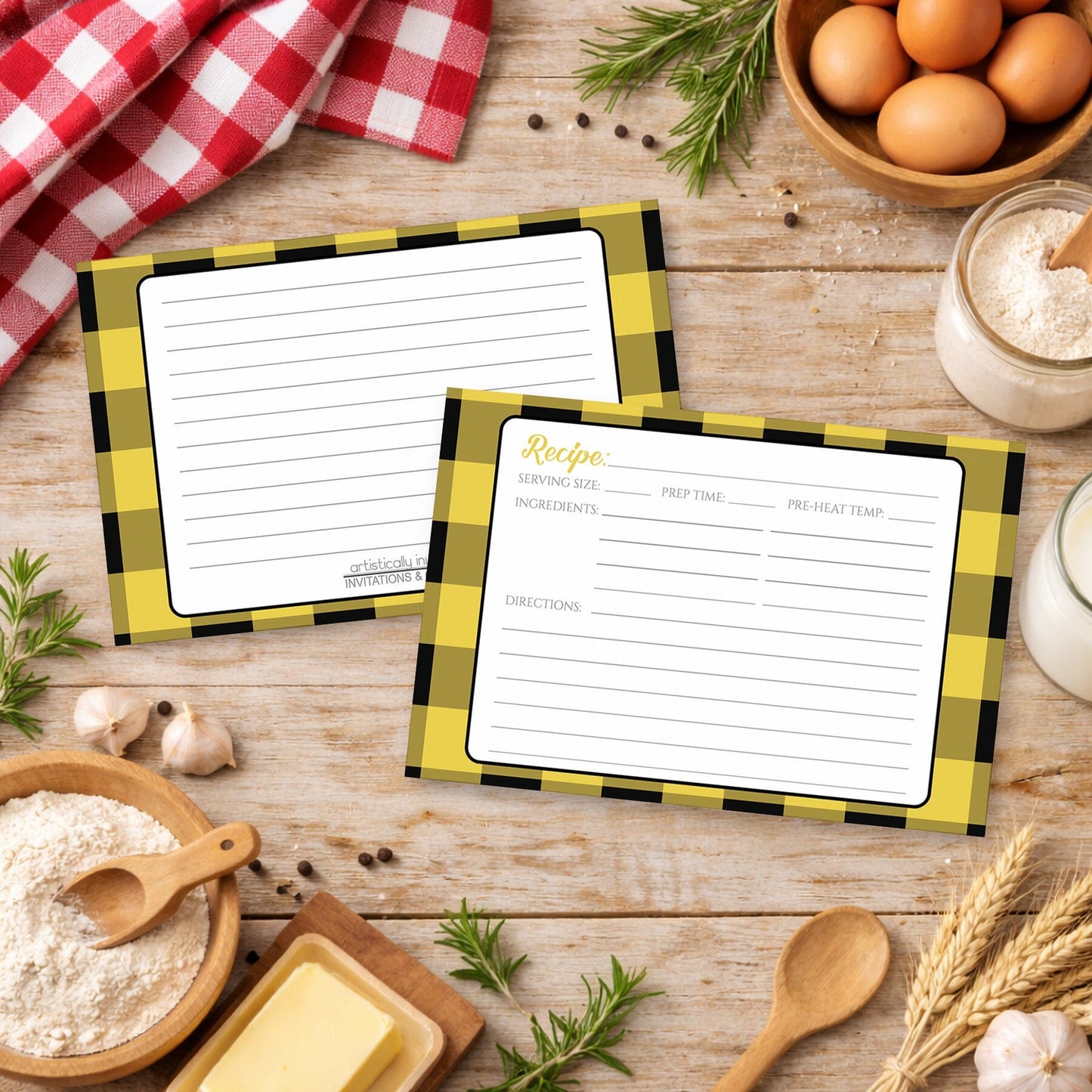 Two Yellow and Black Buffalo Plaid Recipe Cards with checkered borders on a rustic wooden surface with country cooking ingredients.