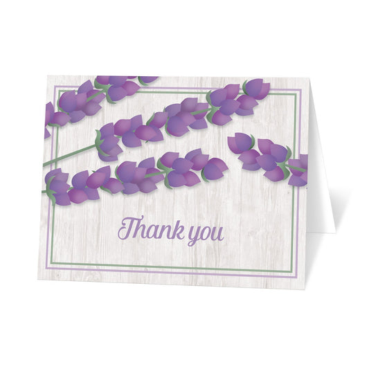 Whitewashed Wood Lavender Thank You Cards at Artistically Invited. Whitewashed wood lavender thank you cards with a rustic chic design featuring illustrated floral purple lavender stems over a light rustic whitewashed wood background design, outlined with purple and green. "Thank you" is printed on the front in a purple script font below the purple lavender, over the whitewashed wood.