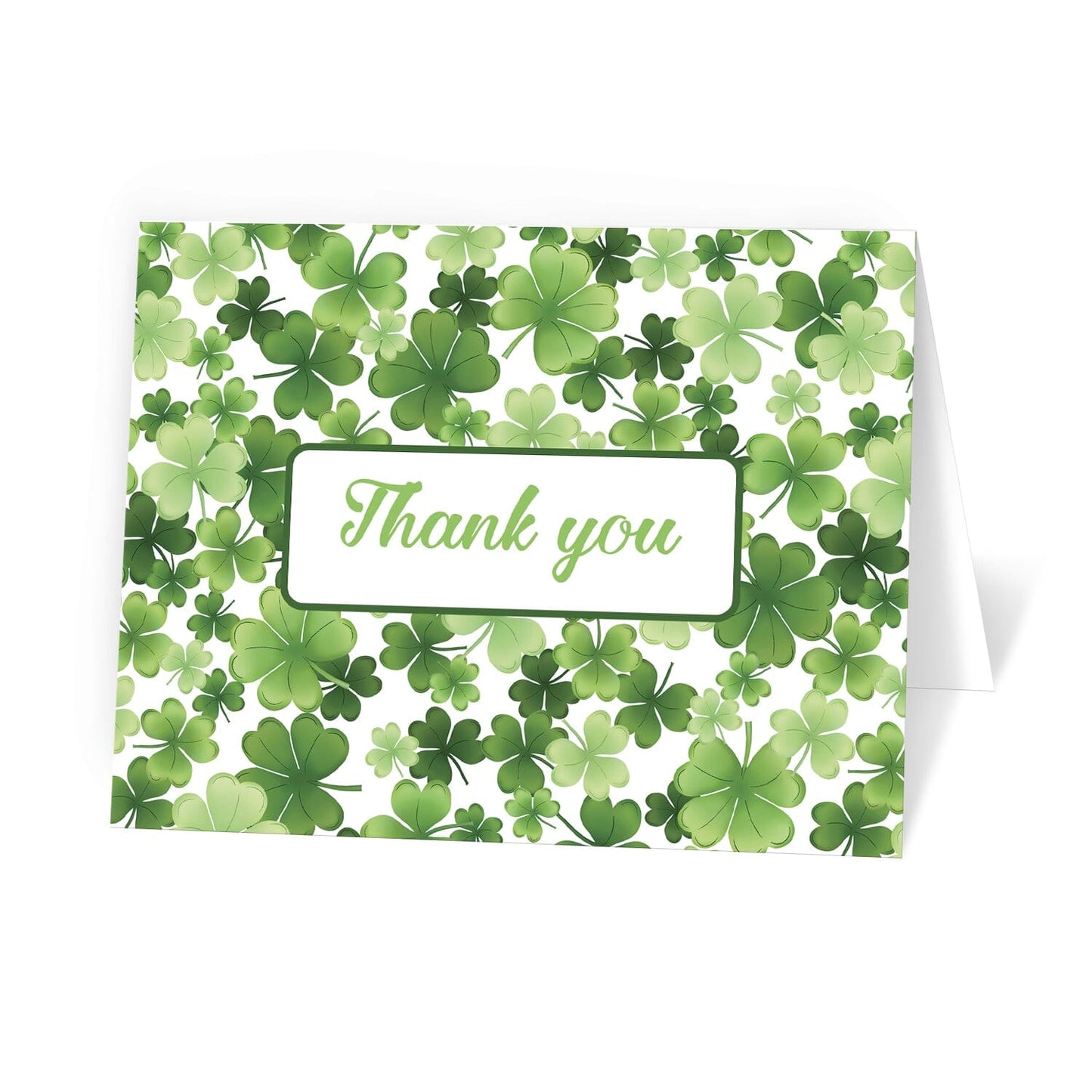 Shamrocks and 4-Leaf Clovers Thank You Cards at Artistically Invited. Luck-inspired thank you cards with "Thank you" on the front in a green script font inside a white rectangle over a gorgeously green pattern design background with shamrocks and 4-leaf clovers in varying sizes and shades of green. 